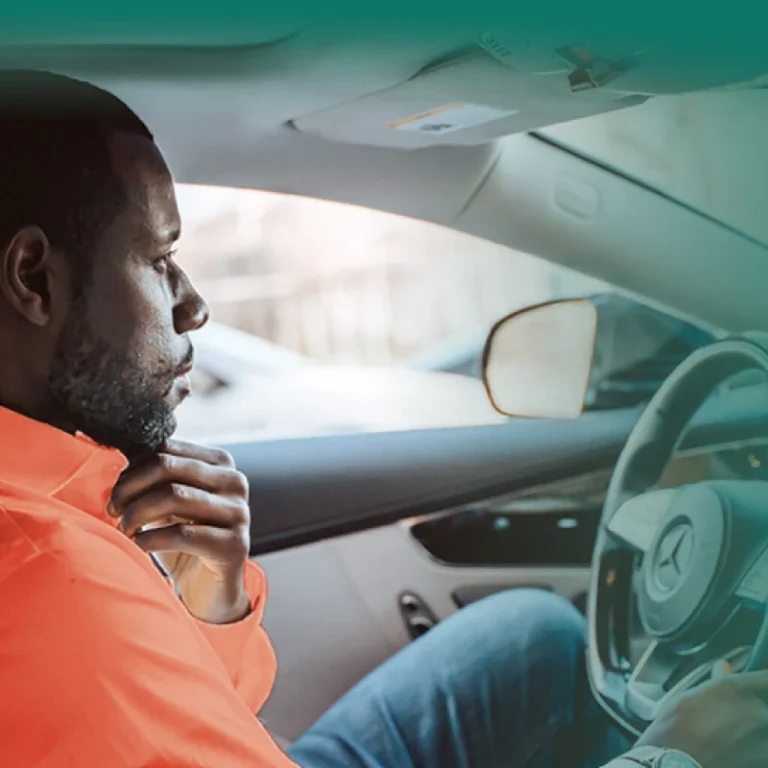 A man driving a car.