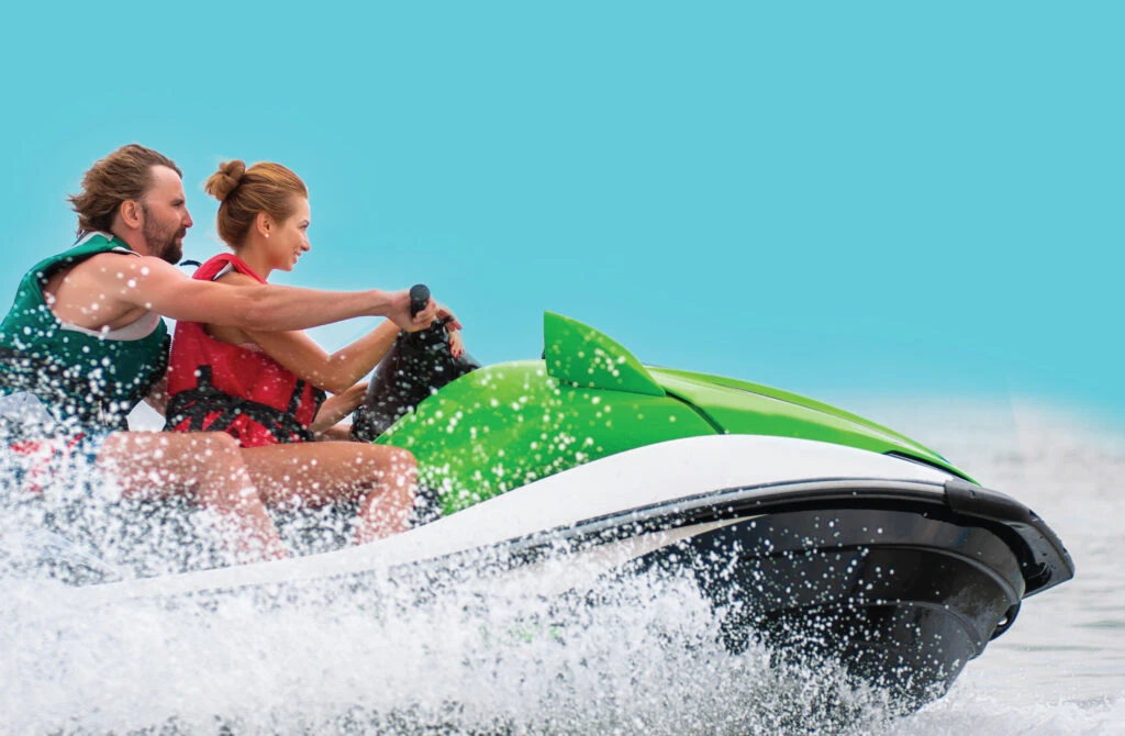 People riding a waverunner