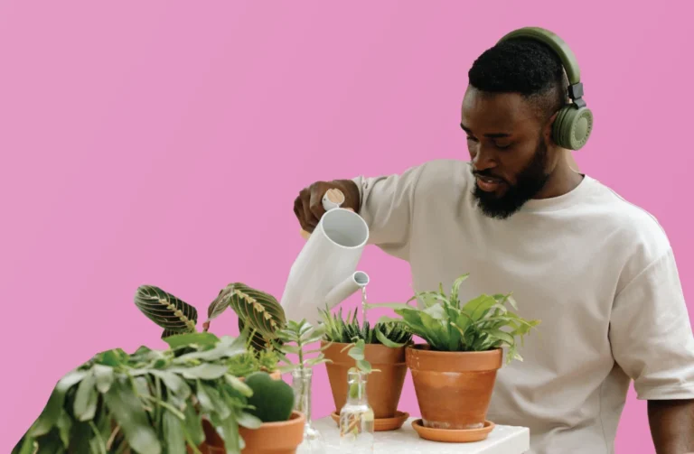 Person watering plants