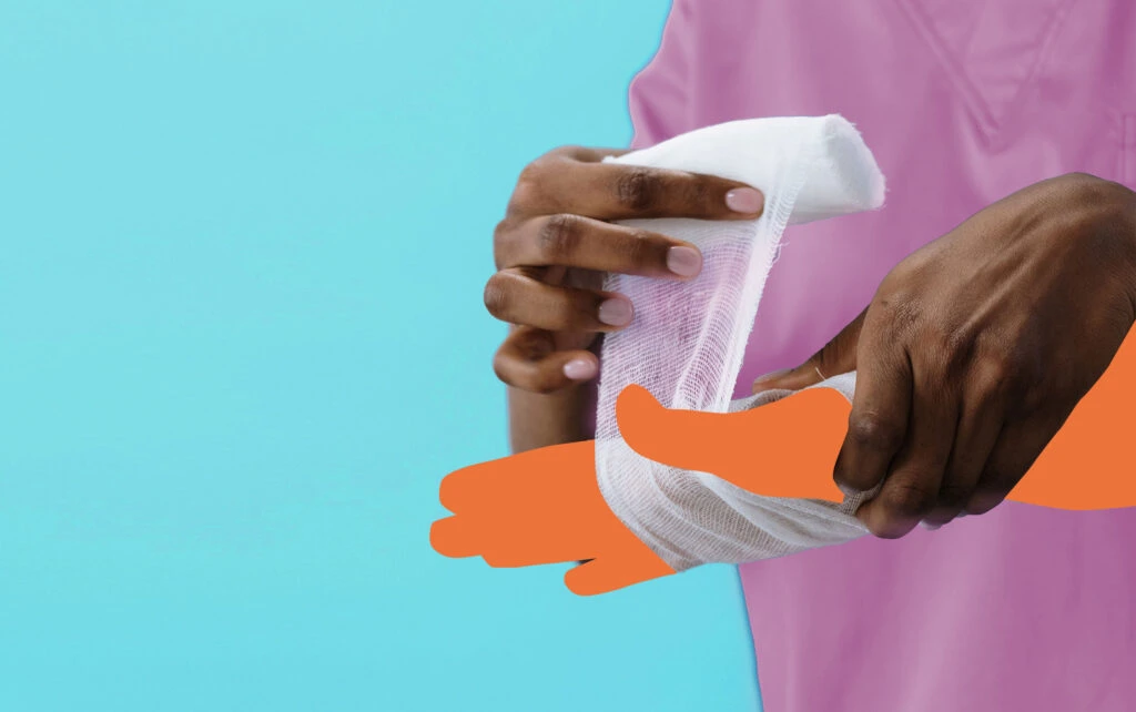 Person wrapping hand injury