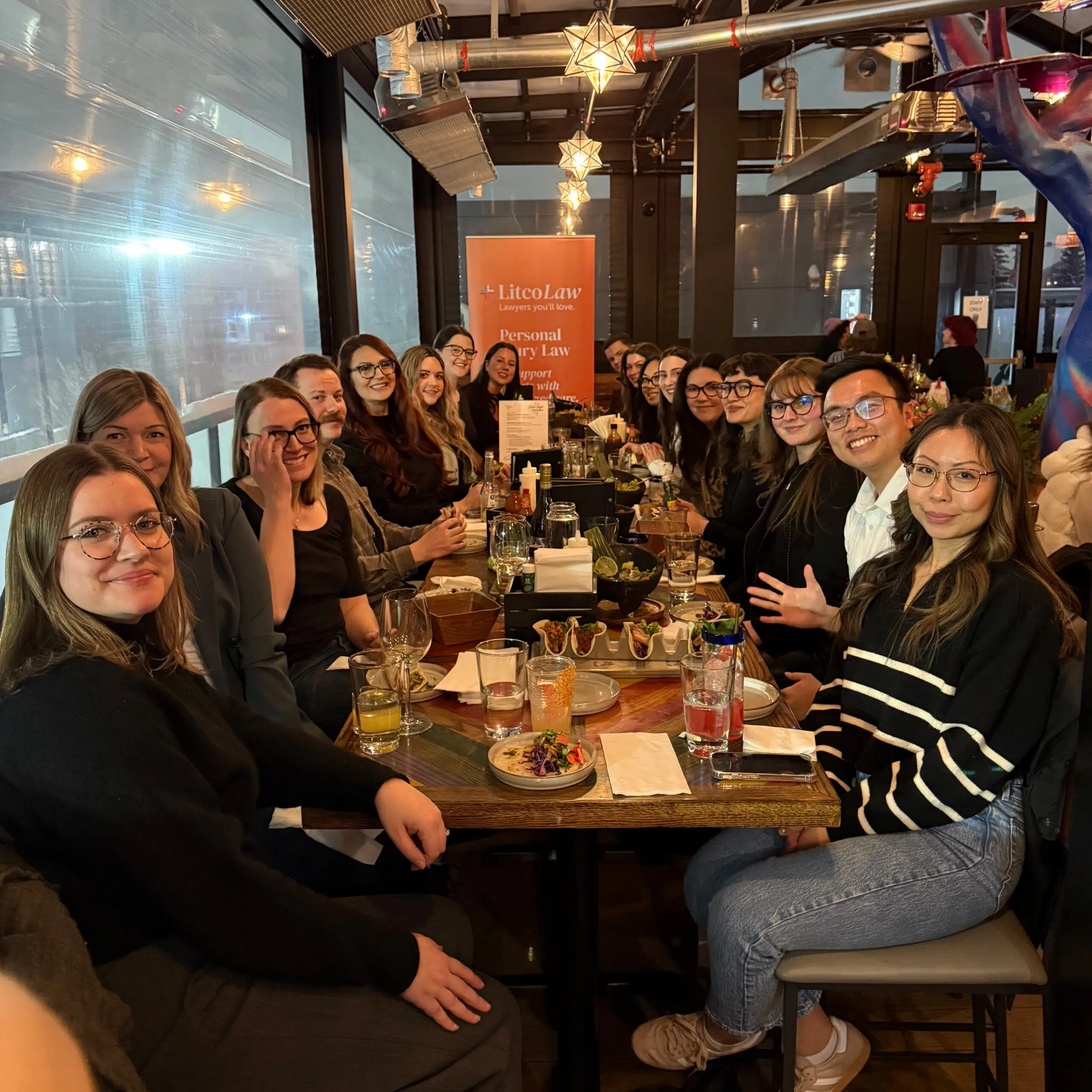 Legal team in a restaurant - Litco law
