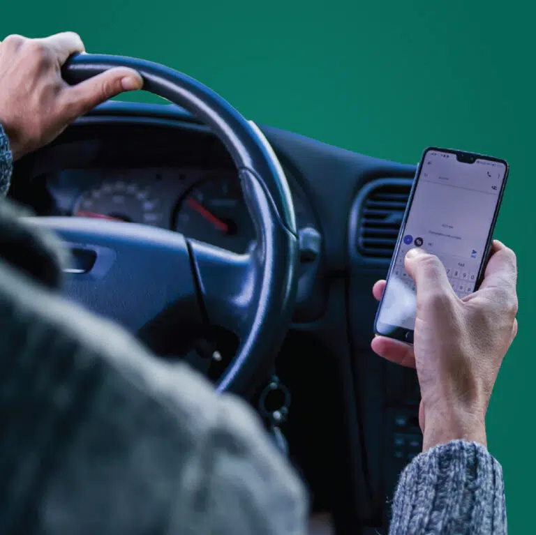 a man with phone while driving