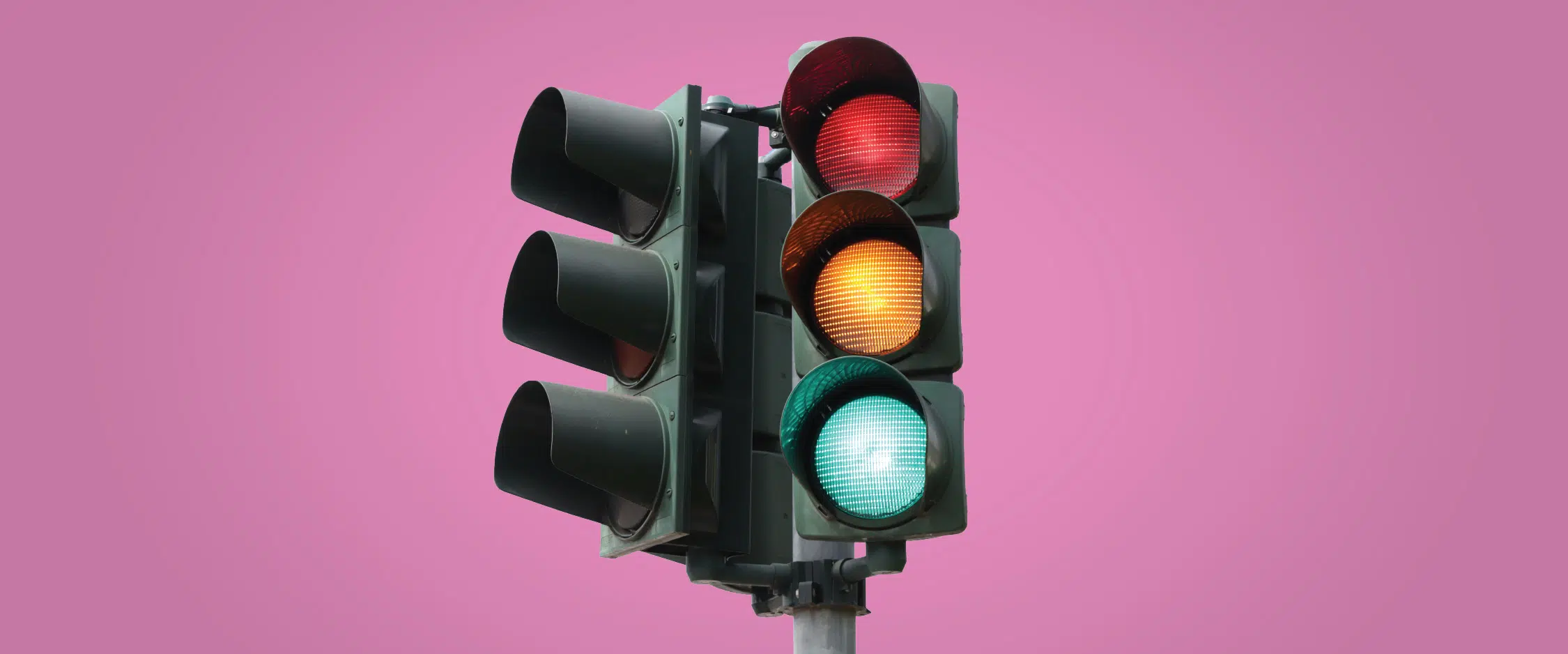 Stoplight on pink background