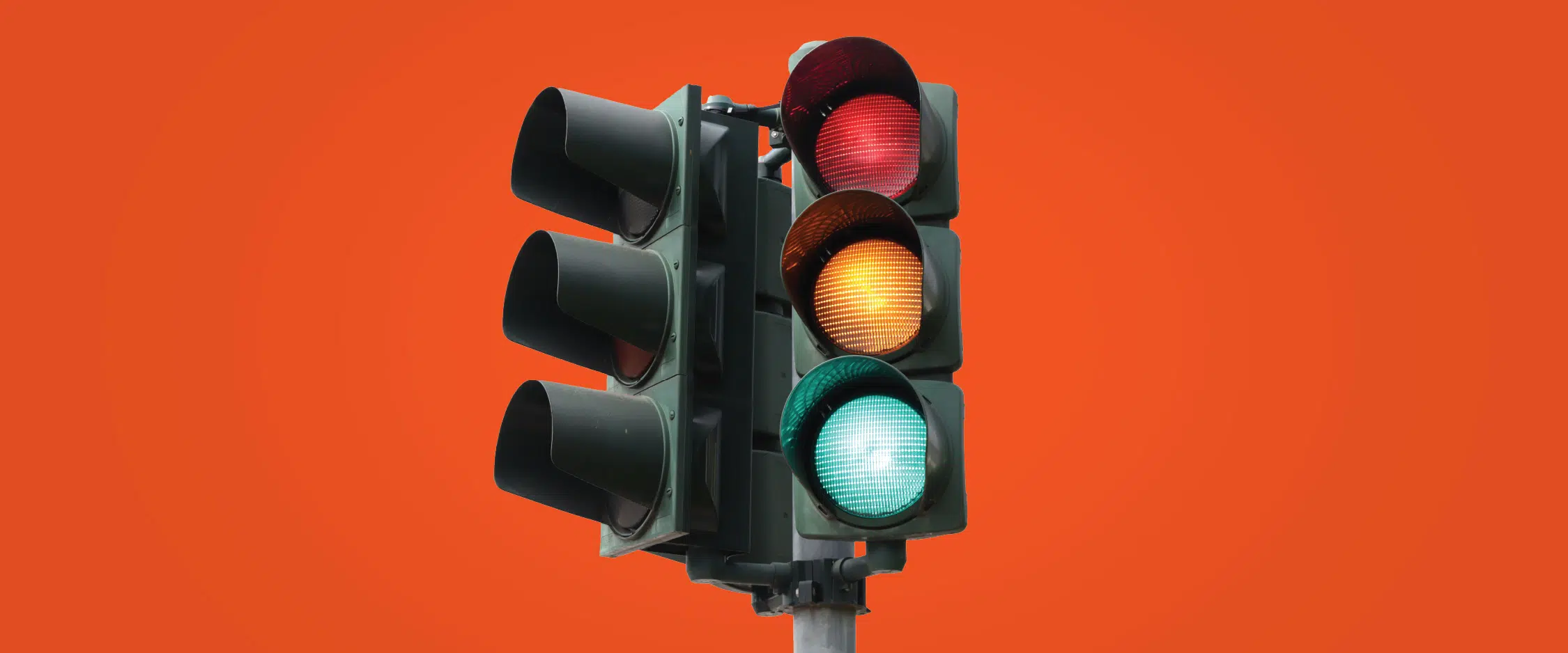 Stoplight on an orange background