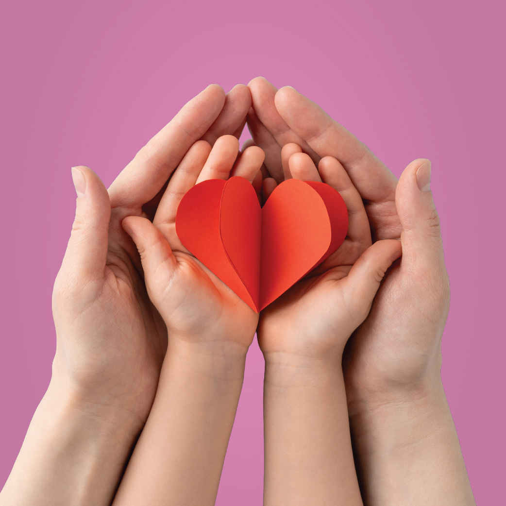 Two family member holding a symbol of love